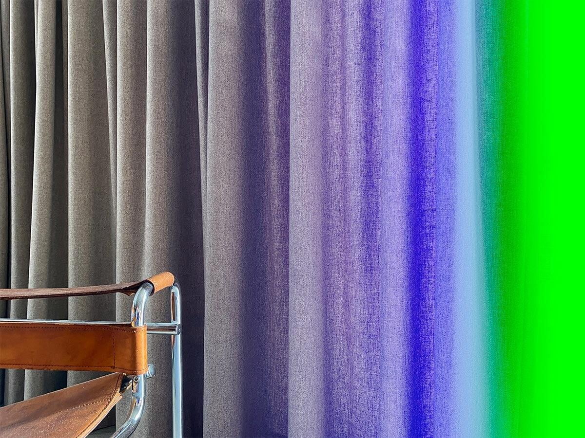curtains and chair in stylised setting. 